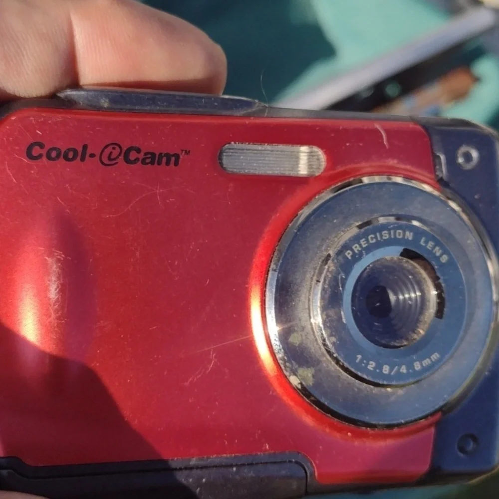 CoolCam WaterproCompact Red Digital Camera with Sleek Design and Ergonomic Shape